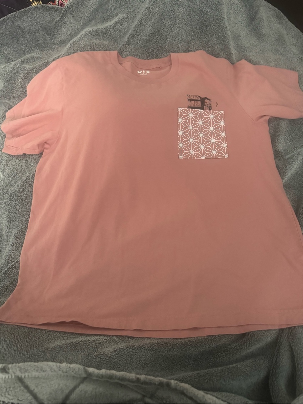 Uniqlo Drkon slayer pink T shirt with geometric design on pocket